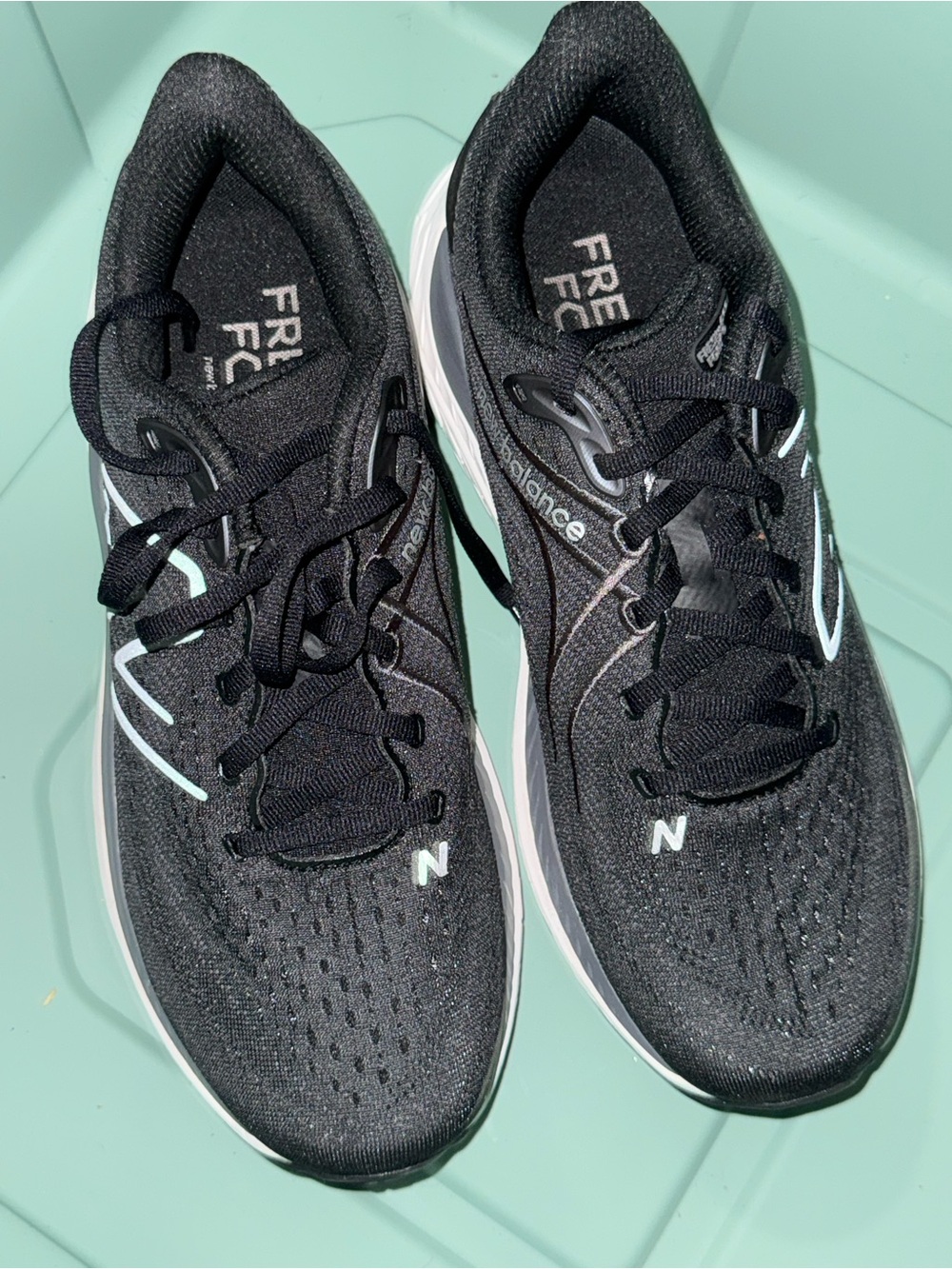New Balance Fresh Foam women’s Black Athletic Running Shoes with White Accents